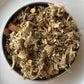 Close-up of Winter Remedy tea ingredients: ginger, cinnamon, and other natural elements for winter warmth.